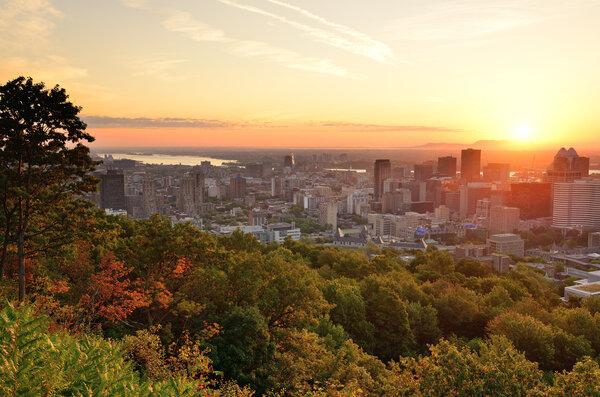 Montreal sunrise viewed from Mont Royal with city skyline in the