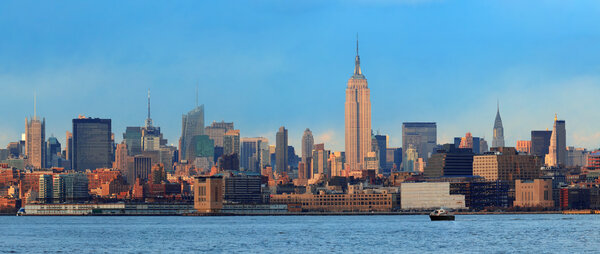 Downtown Manhattan skyline at sunset over Hudson River in New York City