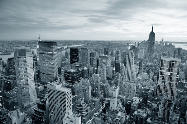 New York City skyline black and white with urban skyscrapers at sunset.