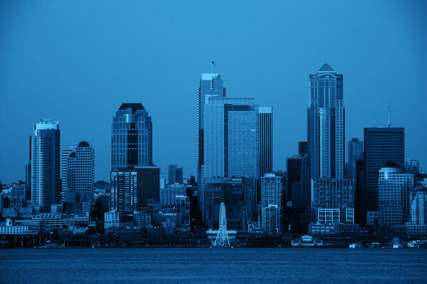 Seattle city skyline view over sea with urban architecture.