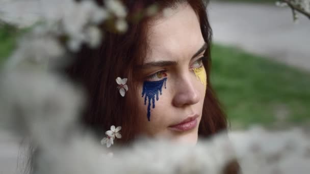 Young Attractive Girl Portrait Ukrainian Flag Spring Cherry Garden — стоковое видео