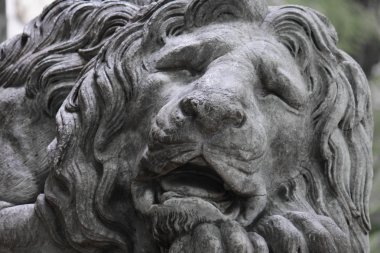 Sculpture of a lion as a symbol of strength clipart