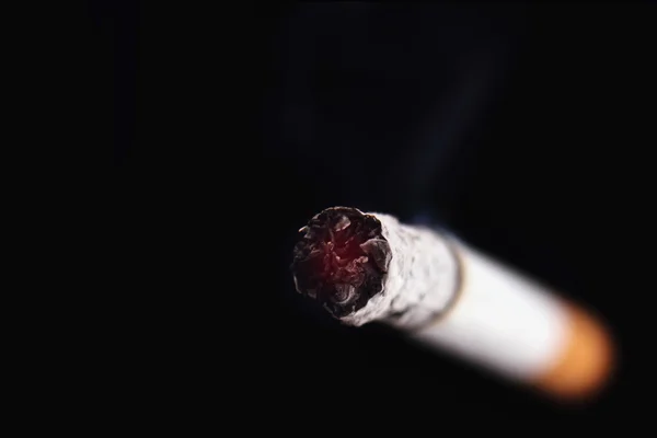 Cigarette on a black background — Stock Photo, Image