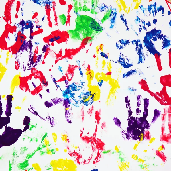 Huellas de manos coloridas en el fondo blanco —  Fotos de Stock
