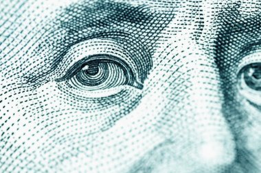 Macro image of US Dollar banknote. Benjamin Franklin's portrait on one hundred Dollar bill.