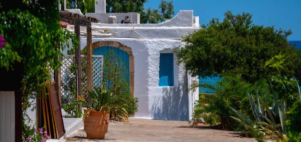Beautiful white ancient house near sea. Travel and summer holiday concept. Horizontal image.