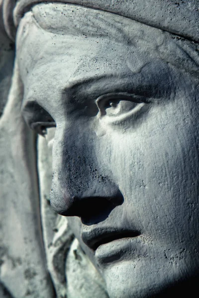 The look of love and eyes of Virgin Mary. Fragment of ancient statue. Vertical image.