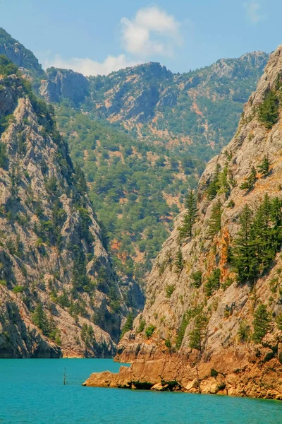 Summer landscape with mountains and lake Green Canyon (Turkey ). Tourism and beauty of Turkey nature. Beautiful mountain lake between rocks. Vertical image.