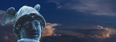 Antique Olympic god of commerce, merchants and travelers Hermes (Mercury). He is also god messenger with wings on his feet and helmet. Copy space.