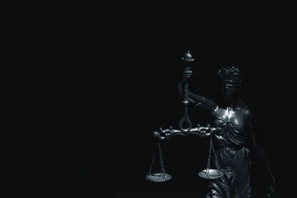 Silhouette of Lady Justice with scales of truth. Conceptual image of justice, law and legal system. Copy space for text.