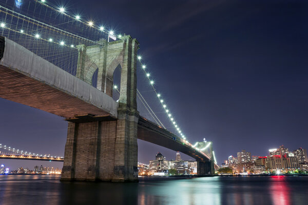 Night Walk on East River near Brooklyn and Manhattan Bridge, New York City.