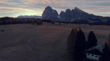 Aerial flight over Alpe de Siusi in the Italian Dolomites, Beautiful Summer Sunrise