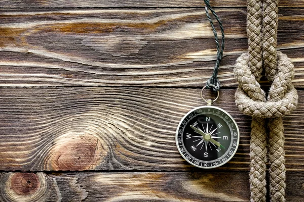 Wood texture with marine knot and compass — Stock Photo, Image