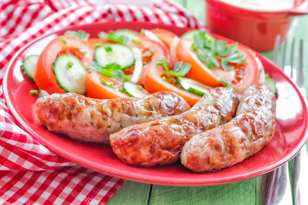 Sausages and salad — Stock Photo, Image