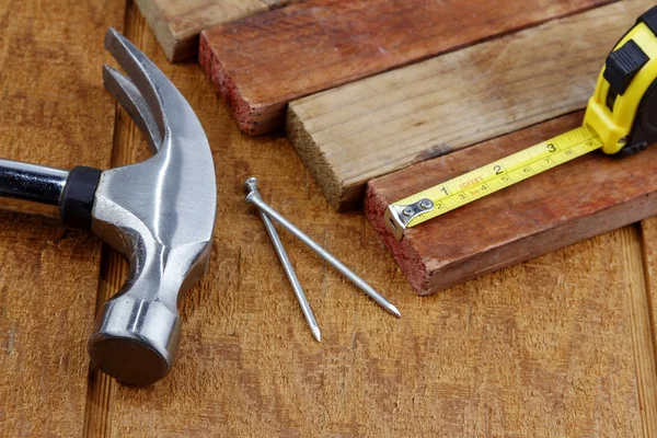 Assorted work tools on wood — Stock Photo, Image