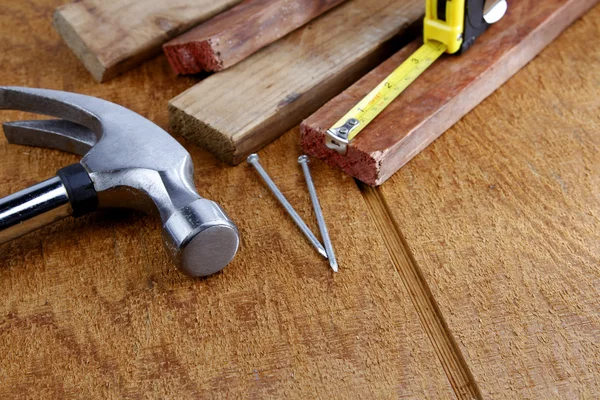 Assorted work tools on wood — Stock Photo, Image