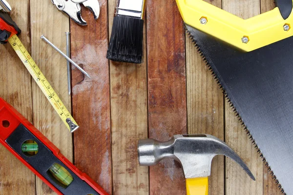 Assorted work tools on wood — Stock Photo, Image