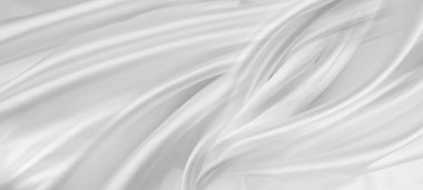 Dalgalanan beyaz ipek kumaş çizgilerinin yakın çekimi