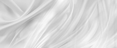 Dalgalanan beyaz ipek kumaş çizgilerinin yakın çekimi