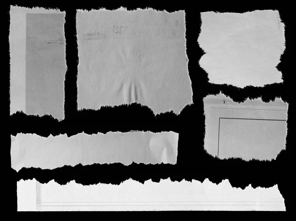 Six pieces of torn newspaper on black background