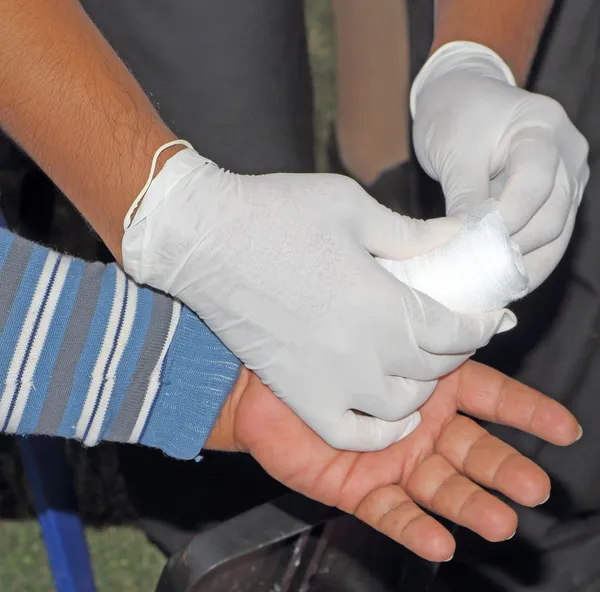 Dressing a wound Stock Photos, Royalty Free Dressing a wound Images