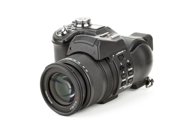 Black digital camera in a white background — Stock Photo, Image