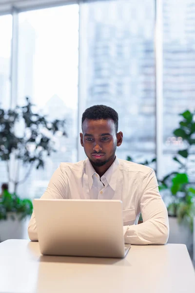 Portrait of young handsome stylish black man enjoying city life