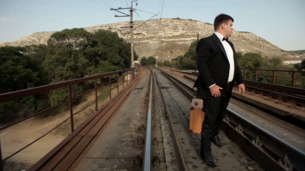 Groom nervously waiting by the rail — Stock Video