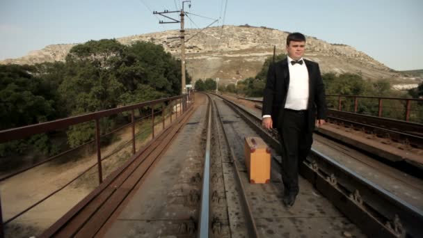 Groom nervously waiting by the rail — Stock Video