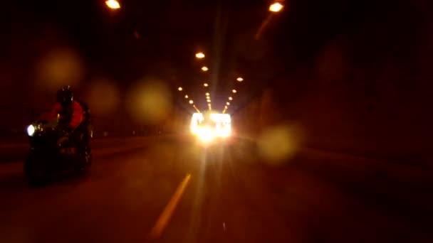 Bikers driving through a tunnel. — Stock Video