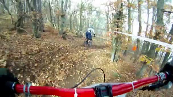 Participants of a bicycle Derby surmounting obstacles on their path. — Stock Video