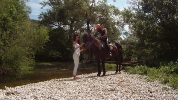 Equestrienne, her horse and a riding instructor. — Stock Video