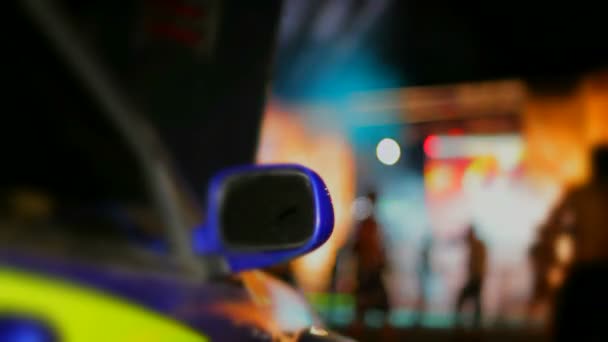Sports car. Rear-view mirror on a beautiful sports car. The background is blurred. — Stock Video