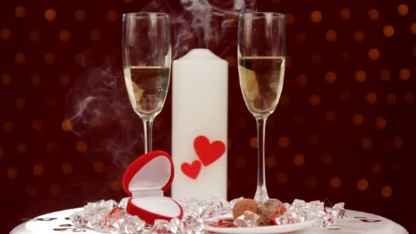 End of a romantic evening. Two beautiful glass of wine are on the background of a lit candle. Then the candle goes out. — Stock Video