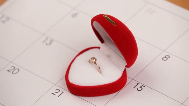 Surprise for Valentines Day. A man puts a wedding ring on Valentine's Day. Close-up. — Stock Video