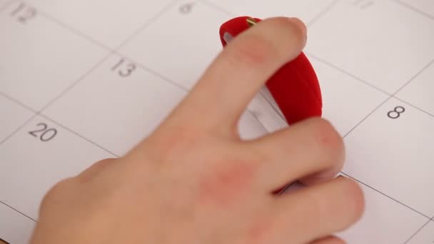 Surprise for Valentines Day. A man puts a wedding ring on Valentines Day. Close-up. — Stock Video