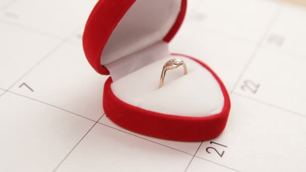 Surprise for Valentines Day. A man puts a wedding ring on Valentines Day. Close-up. — Stock Video