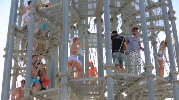 CRIMEA, UKRAINE, 03 AUGUST 2013, Official opening of Kazantip festival. People exploring an art installation on the territory of the festival. — Stock Video