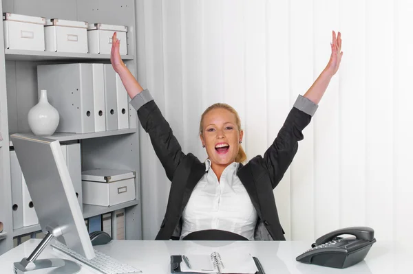 Young successful woman in an office — Stock Photo, Image