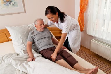 Nurse in elderly care for the elderly in nursing homes clipart