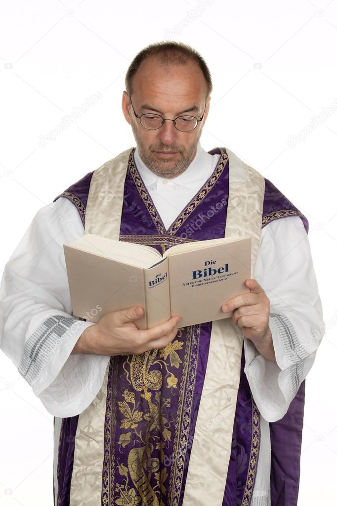 Catholic priest with bible in church — Stock Photo © ginasanders 12824113