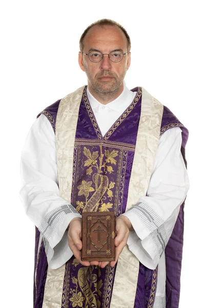 Catholic priest with bible in church — Stock Photo, Image