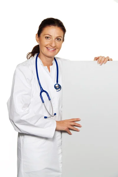 Young successful doctor with board — Stock Photo, Image