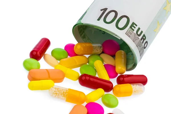 Tabletten en 100 euro bill — Stockfoto