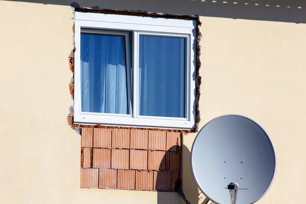 New window with satellite dish — Stock Photo, Image