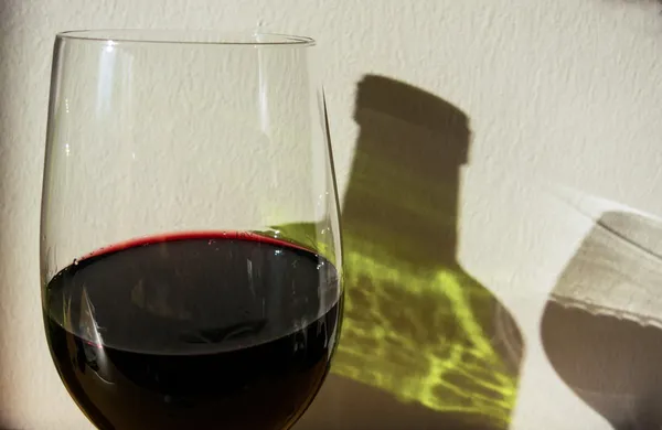 Red wine bottle and glass — Stock Photo, Image