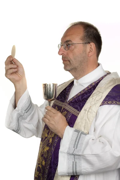 Catholic priest during communion in worship — Stock Photo, Image