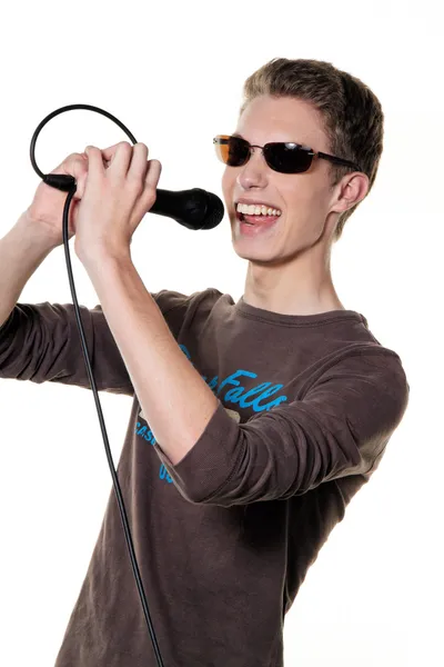 Young singer with microphone — Stock Photo, Image