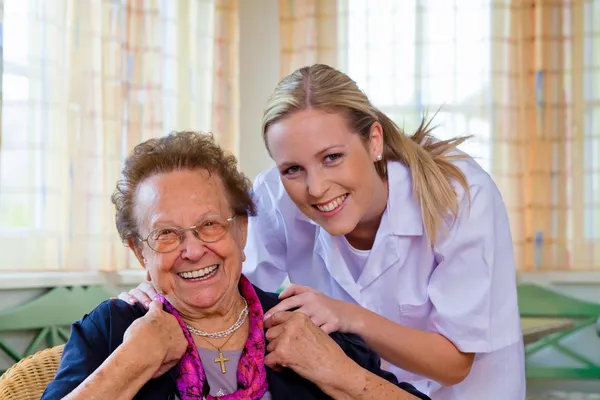 Home care of the old lady Stock Photo
