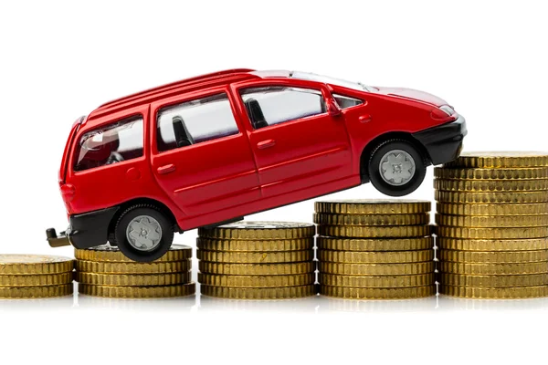 Rising car costs. car on coins — Stock Photo, Image